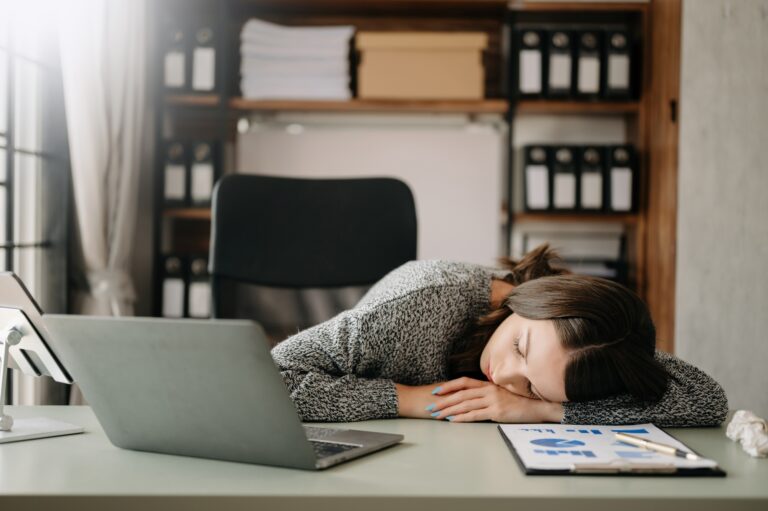 woman feeling migraine head strain.Overworked businesswoman financier while working